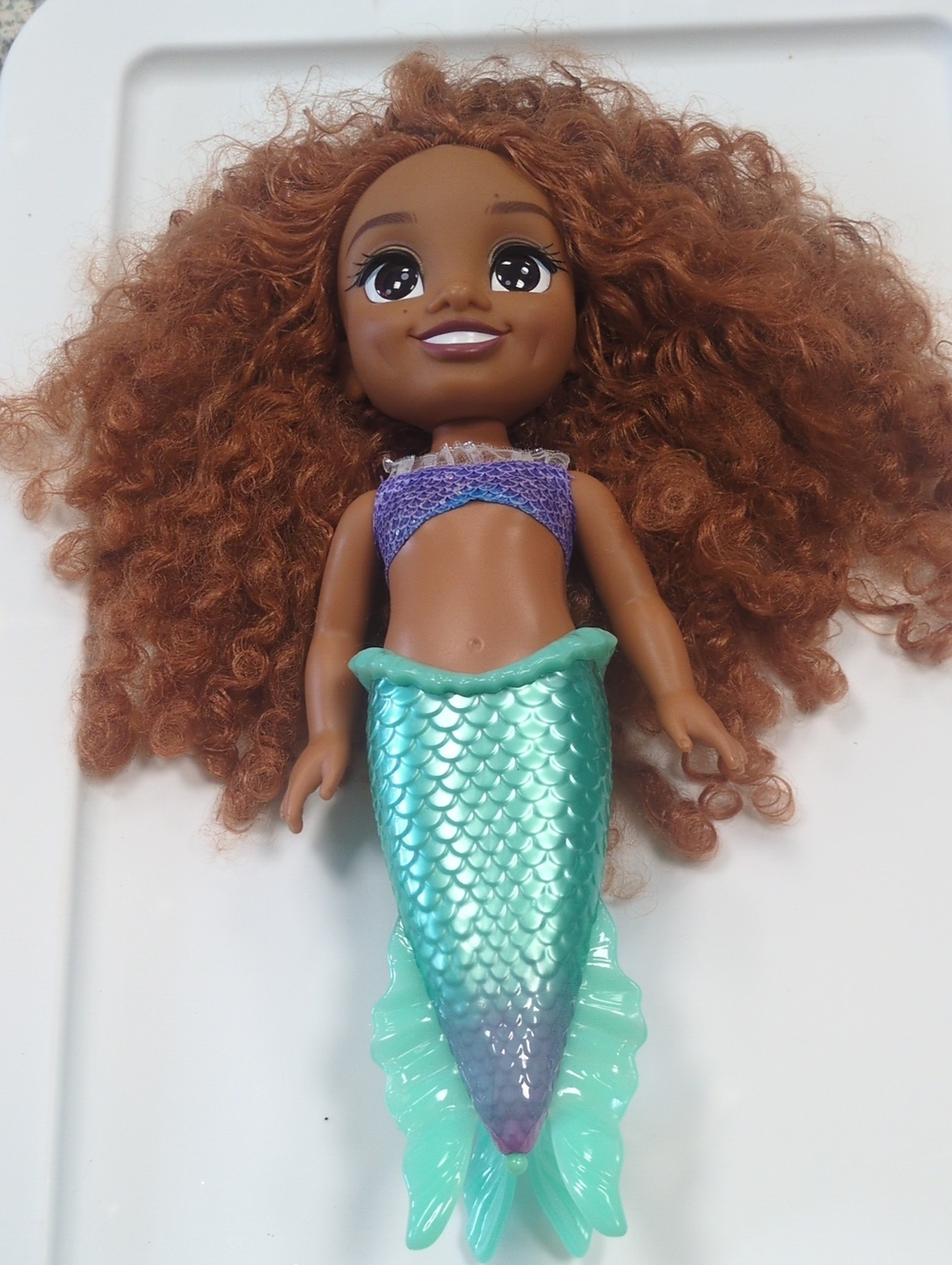 Curly-Haired Mermaid Doll with Turquoise Tail and Purple Top